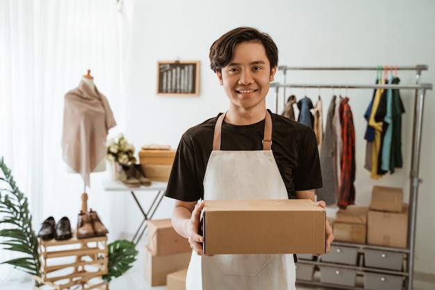 Asian young man working in a clothing store