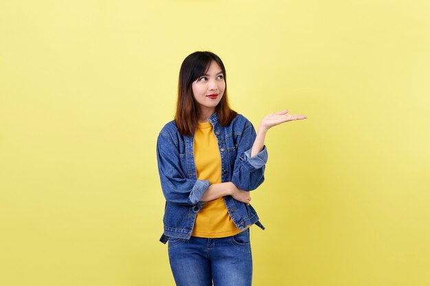 Asian young woman brunette in the jacket jean smiling posing