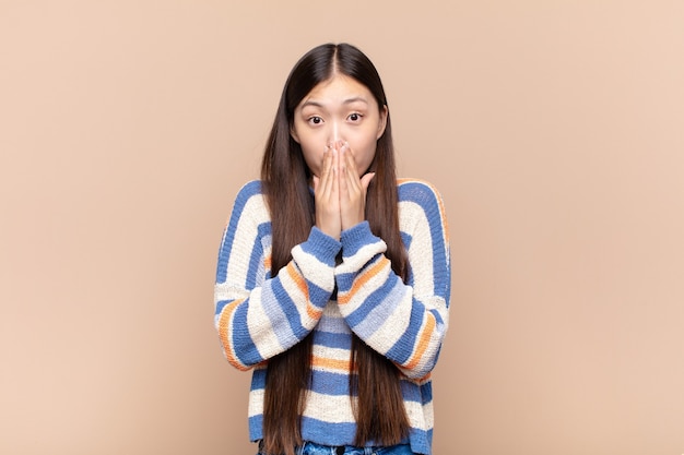 Asian young woman feeling worried, upset and scared isolated