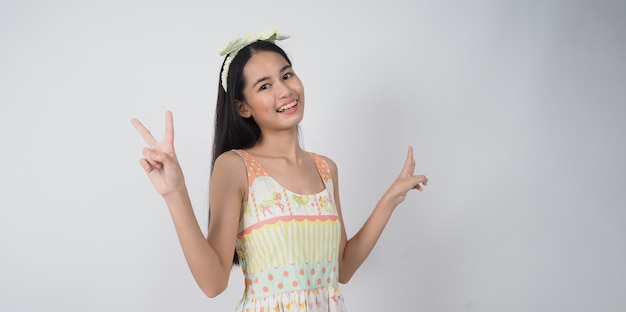 Asian young woman gesture posing on white background represent cheerful and confident showing