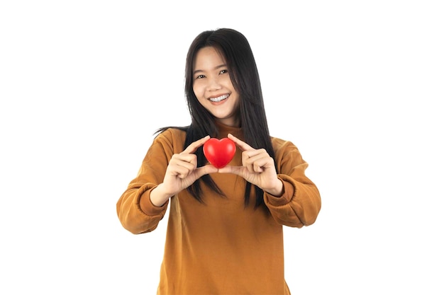 Photo asian young woman holding red heart isolated on white background with clipping path health insurance