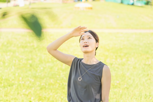 Asian young woman relaxing in the green