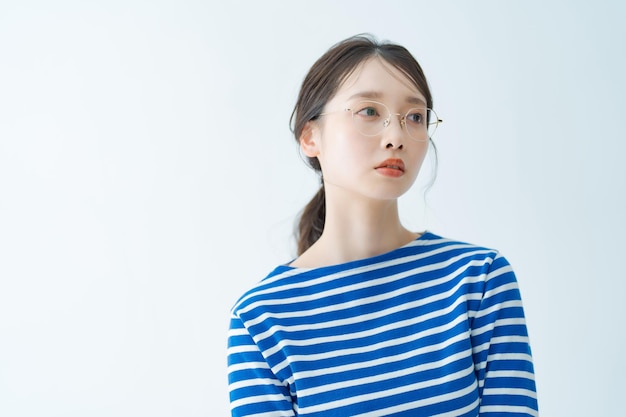 Asian young woman wearing glasses indoors