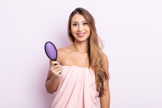 asiatic pretty woman looking happy and pleasantly surprised. hair care concept