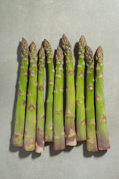 Asparagus on the kitchen table Gray background Cooking