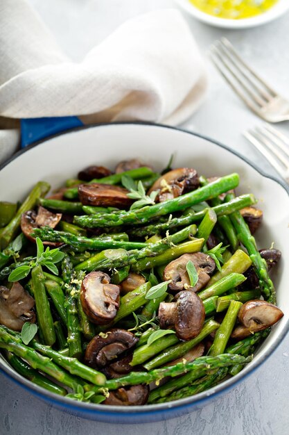 Asparagus and mushrooms in a cast iron pan