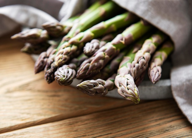 Asparagus on old wooden background