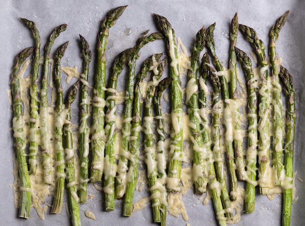 Asparagus with cheese baked in the oven