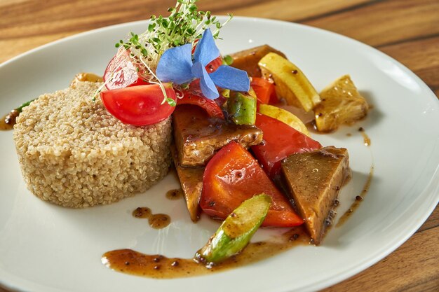 Asparagus with seitan tofu cheese in a white plate Vegetarian food