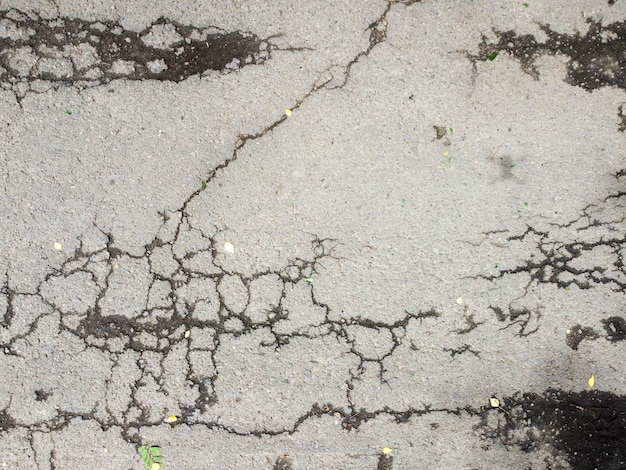 Asphalt background with cracked texture