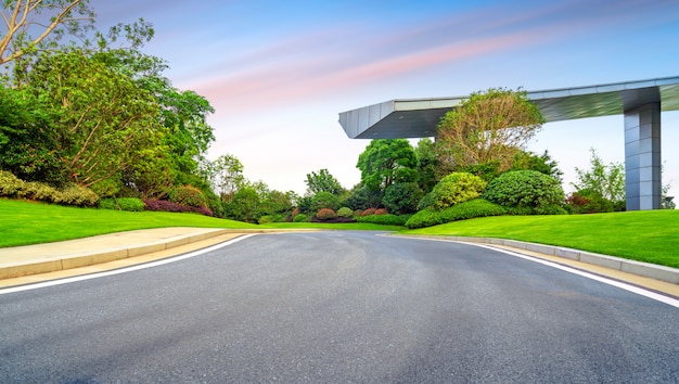 Asphalt highway next to modern building