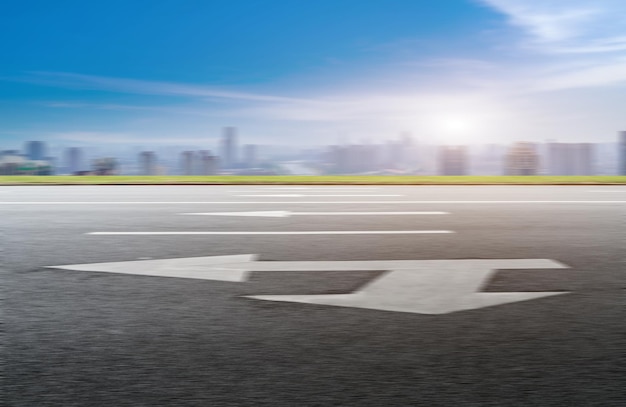 Asphalt pavement and urban building skyline