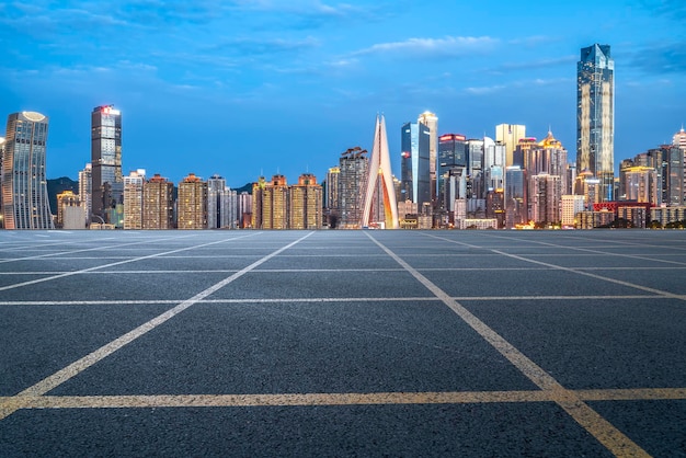 Asphalt pavement and urban building skyline