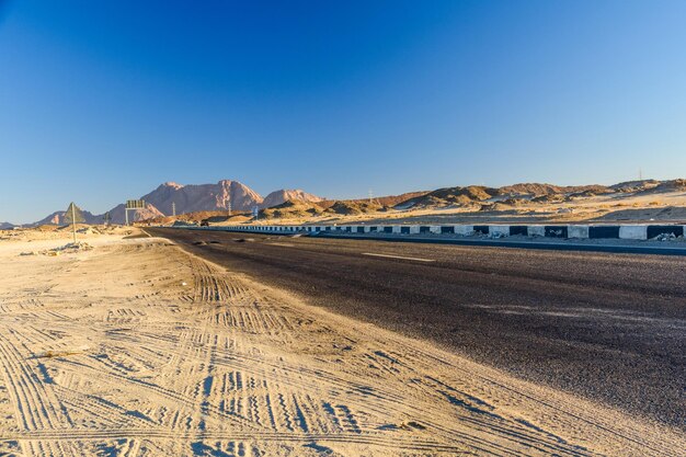 Asphalt road in arabian desert not far from the Hurghada city Egypt