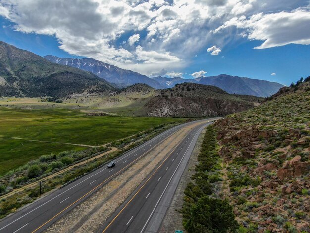 Asphalt road bends through the mountain