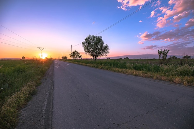 Asphalt road with landscape at the sunsetxA