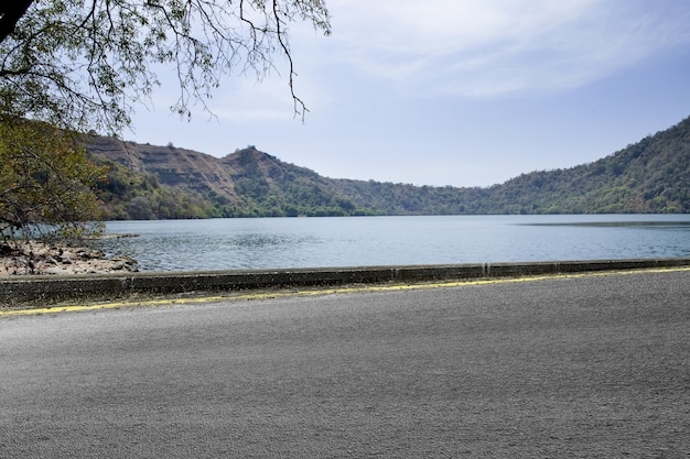 Asphalt road with valley view and blue sky