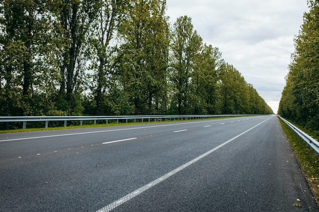 Photo asphalt road with white markings   background