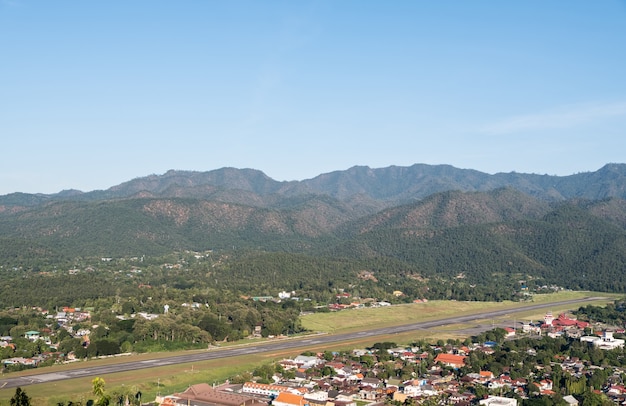 Asphalt runway of the small airport in the valley.