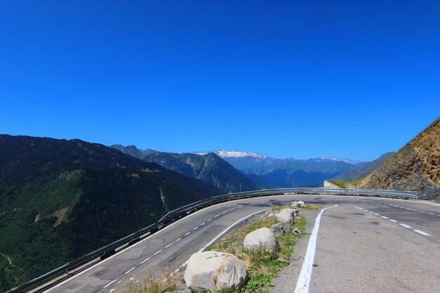 Asphalted road with tight bend in Pla de Beret, Baqueira.