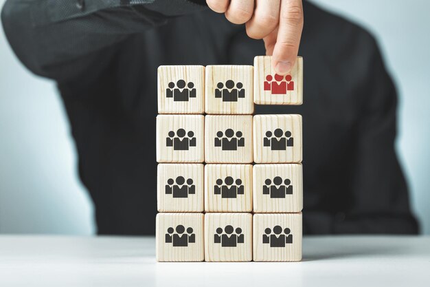 Assembled wooden cubes on the theme of business leadership