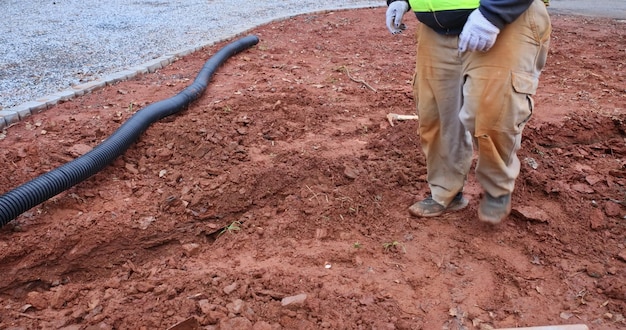 Assembling drainage pipe for rain water that is going to be used for rain water collection on covere