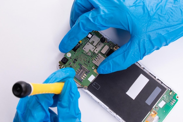 Assembling a mobile phone on a white background