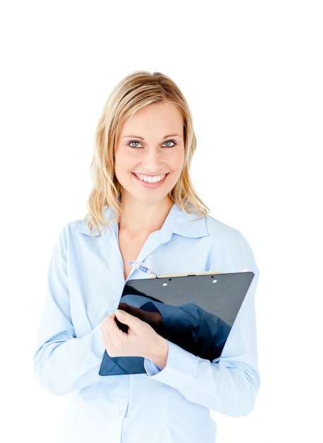 Assertive businesswoman taking notes on a clipboard