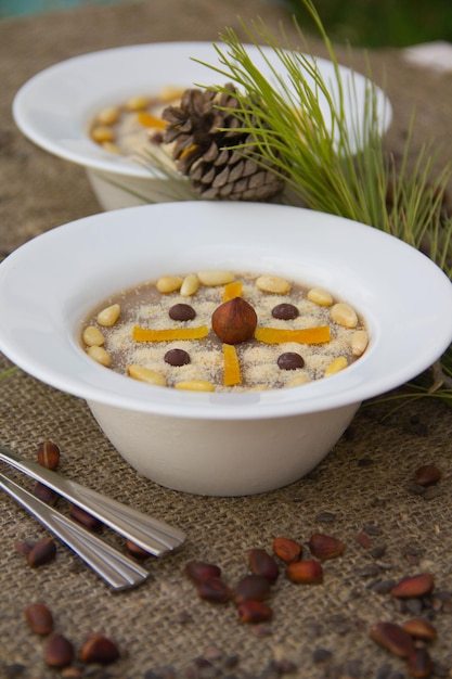 Assidat zgougou in white plate - traditional tunisian dessert prepared for celebration the birth of prophet.Close up