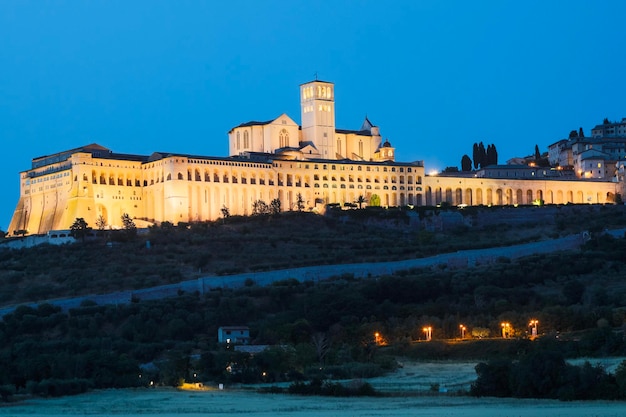 Assisi Basilica by night Umbria region Italy The town is famous for the most important Italian Basilica dedicated to St Francis San Francesco