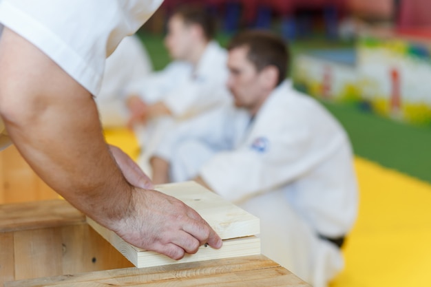 Photo assistant stacks the wooden boards