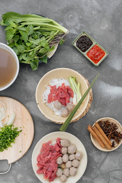 Assorted asian dinner with vietnamese noodle soup pho bo,