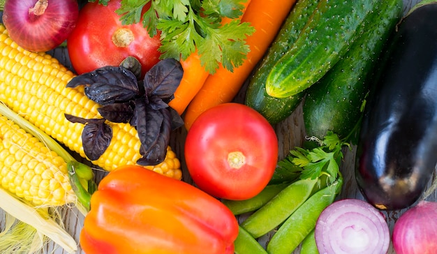 Assorted assorted fresh vegetables on a wooden surface Healthy food concept