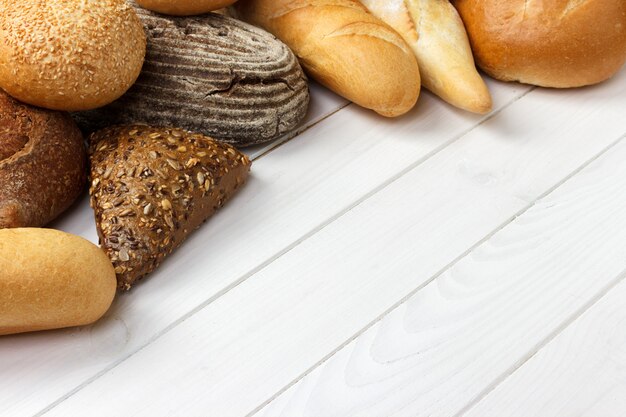 Assorted of bread on white wood