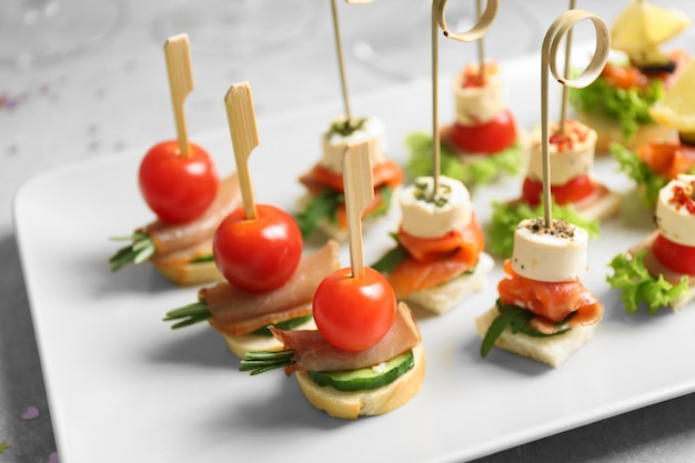 Assorted canapes on table closeup