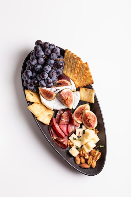 Assorted cheese, prosciutto, nuts, snacks and fruits