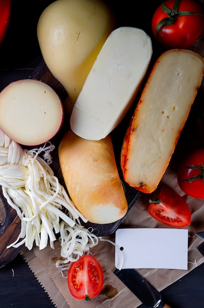 Assorted cheeses in various shapes and sizes