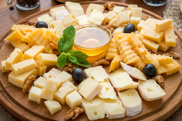 Assorted cheeses with honey and nuts