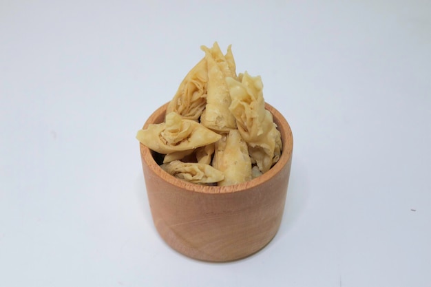 Assorted chips in bowls An assortment of fast carbohydrates Junk food on a white background