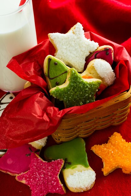 Assorted christmas cookies on red background.