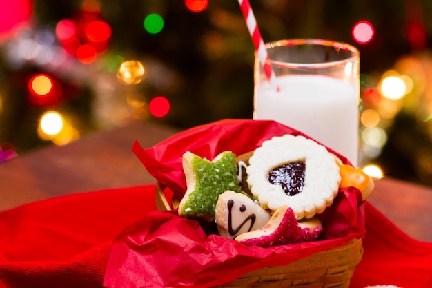 Assorted christmas cookies on red background.