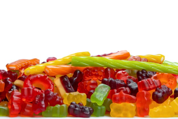 Assorted colorful gummy candies Top view Jelly donuts Jelly bears Isolated on a white background