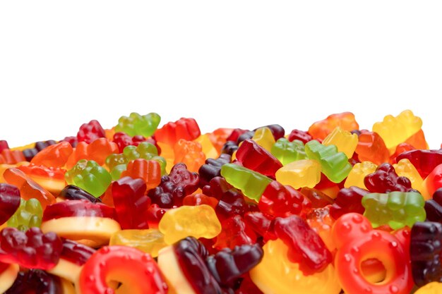 Assorted colorful gummy candies Top view Jelly donuts Jelly bears Isolated on a white background