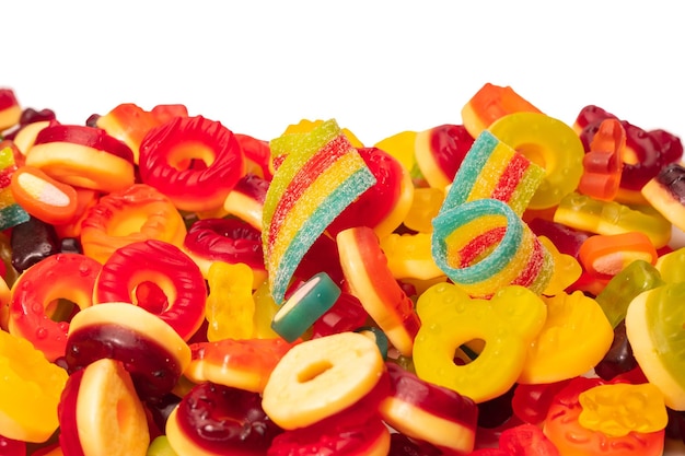 Assorted colorful gummy candies Top view Jelly donuts Jelly bears Isolated on a white background