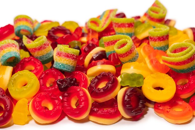 Assorted colorful gummy candies Top view Jelly donuts Jelly bears Isolated on a white background