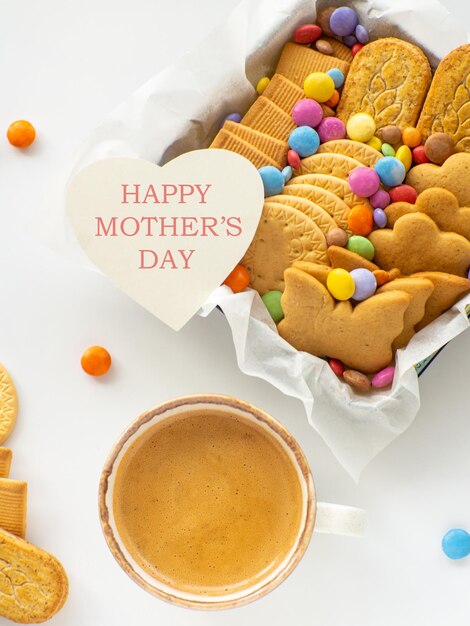 Assorted cookies and candies in the basket mothers day concept