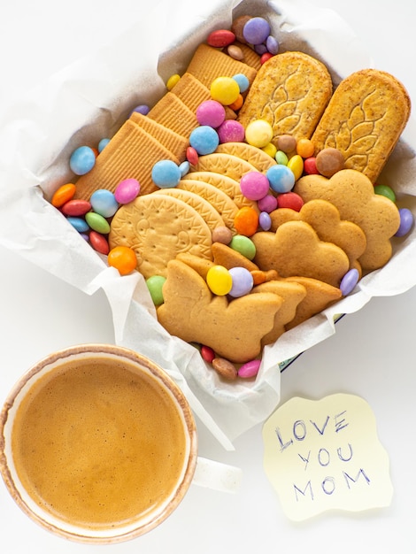 Assorted cookies and candies in the basket mothers day concept