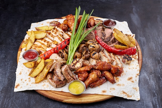 Assorted delicious grilled meat with vegetable.