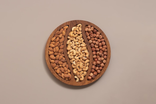 assorted different nuts on a background with a place for text