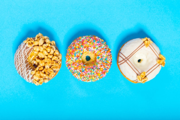 Assorted donuts on a blue background